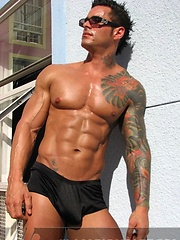 Jock poses outside and jerks off on bed